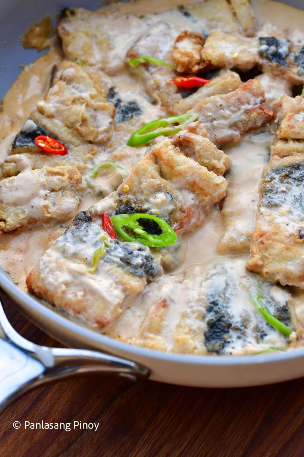 Fried bangus cooked in coconut milk